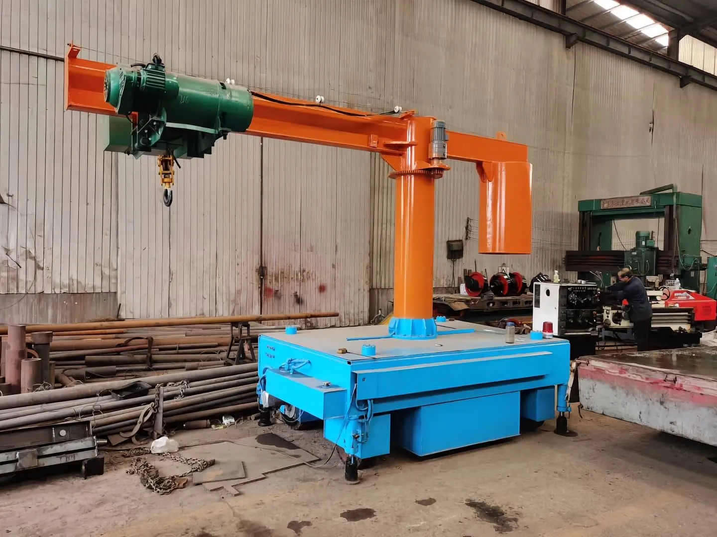 Jib crane with wire rope hoist mounted on a mobile cart base