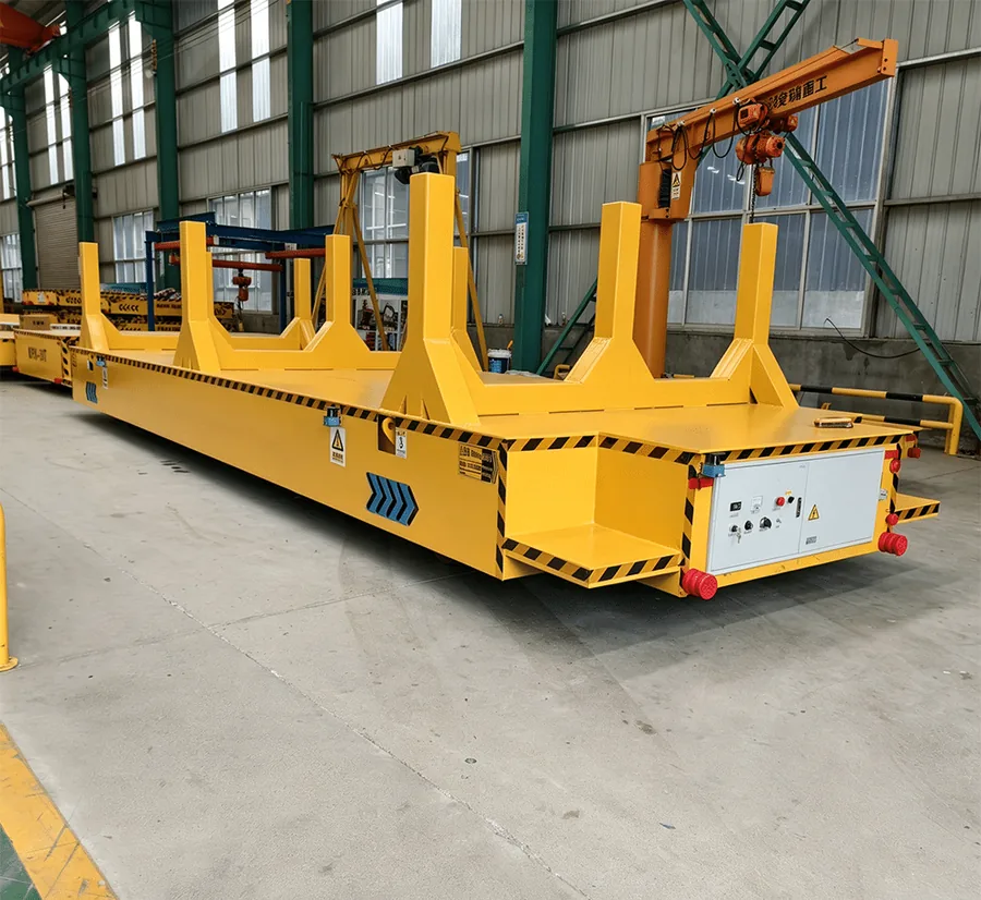 Rail powered electric transfer cart carrying steel coils