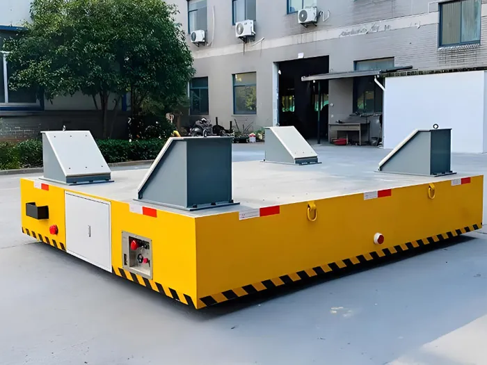 Trackless transfer cart with V-shaped cradle supports for coils and cylindrical loads