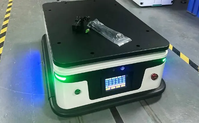 Compact platform AGV with front touchscreen and green status lights