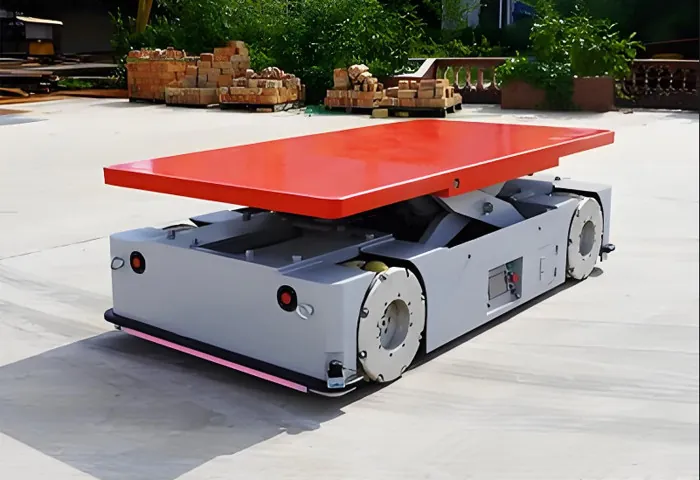 AGV transfer vehicle with its load deck raised on a lifting mechanism
